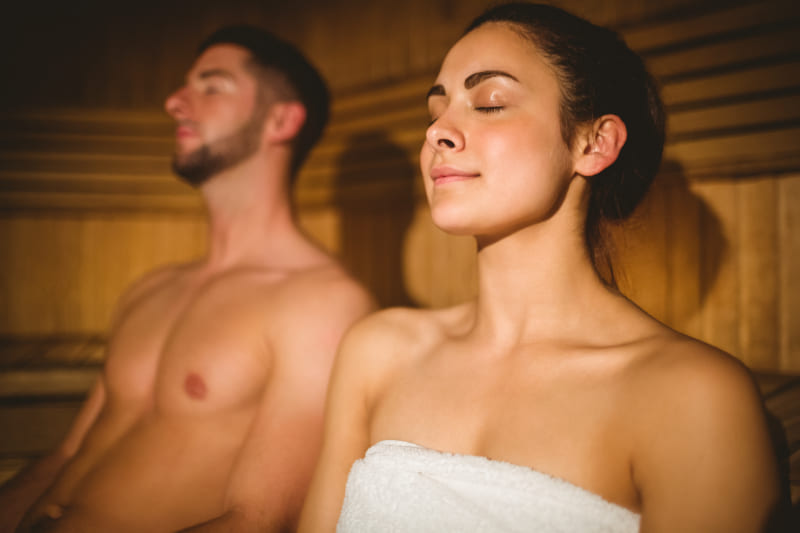 13255832-happy-couple-enjoying-the-sauna-together (1)